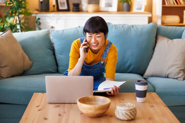 Woman working from home having phone conversation