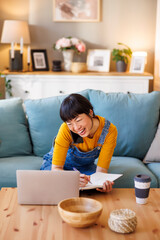 Woman working remotely from home having phone conversation