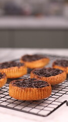 Chocolate bagel cake with sprinkles on top