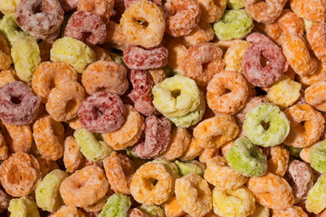  Full frame photo of round multicolored cereals, top view. Breakfast cereal concept.