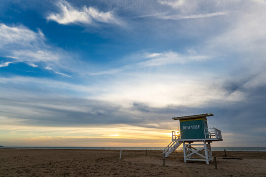 Retro lifeguard station tower on the beach of Deauville at sunset in Normandy, France