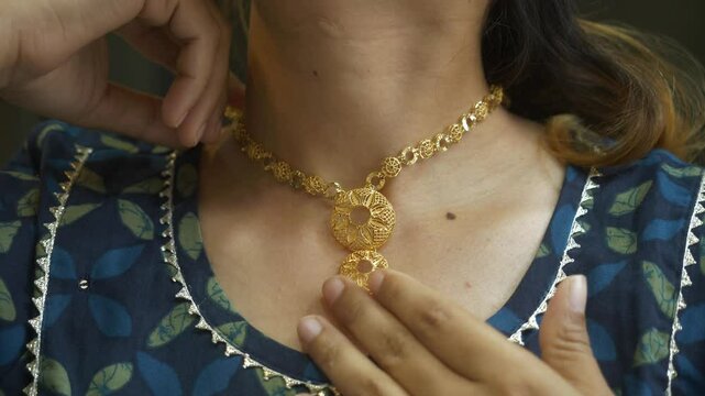 Closeup of neck with designer gold necklace, 18k HUID certified gold necklace, Closeup