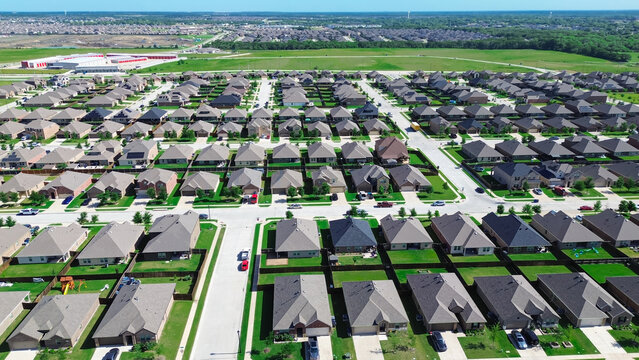 Large vacant land, storage units, new construction site in fast growing Dallas Fort Worth metropolitan area expansion to Princeton, Texas, two story homes, young trees immature landscaping yard