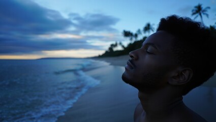 Fototapeta premium peaceful introspective man standing on a serene beach during twilight with eyes closed enjoying the calm ocean breeze and tranquil atmosphere