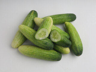 Piled of cucumbers on white background