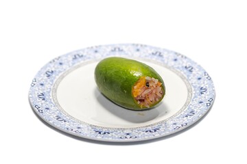 Sticky rice with mango served on dish on white background.