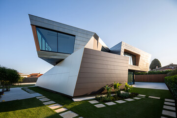 Modern angular house with metal and white paneling exterior design