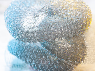 Abstract texture. Coloured metallic abstract. Twisted shiny metal wire. Selective focus