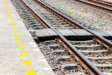 Pictures of railroad tracks in concept train station.