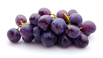 A close up shot of a bunch of fresh dark purple grapes with water droplets on a white background surface