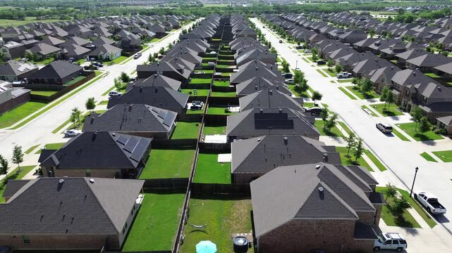 Large backyard of modern new construction suburban homes outside Dallas Fort Worth metroplex, fast growing DFW metroplex metropolitan to surrounding countryside in Princeton, Texas, flyover