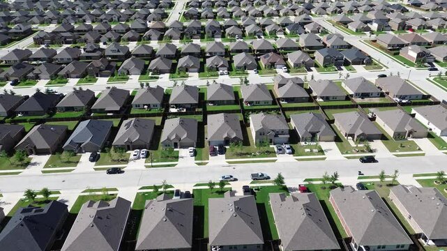 Solar roof panels on modern sustainable new construction suburban homes outside Dallas Fort Worth metroplex, fast growing DFW metroplex metropolitan to surrounding countryside in Princeton, Texas