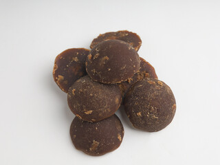 Palm sugar with round shape, isolated on white 