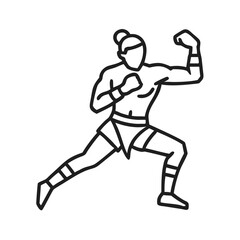 Fototapeta premium Fighter demonstrating a powerful stance during a training session in an urban gym environment