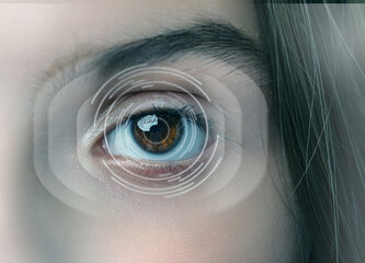Close-up view of an eye showcasing vibrant colors and digital graphics representing technology in...