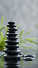 Serene stack of black stones in tranquil water