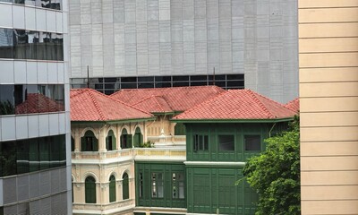 Historic House Contrasting Modern Buildings in Bangkok, Thailand