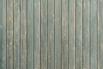 Weathered vertical wooden planks with visible grain and knots create a rustic textured surface ideal for backgrounds, design, or mockups.