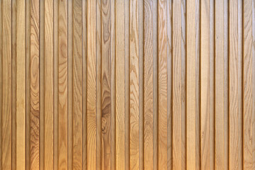 Natural vertical wooden slats create a warm textured surface, evoking organic simplicity and modern...