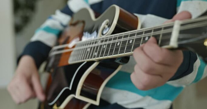 Caucasian Kid Play Mandolin at Home. European Boy Practice Music 4K 10-bit