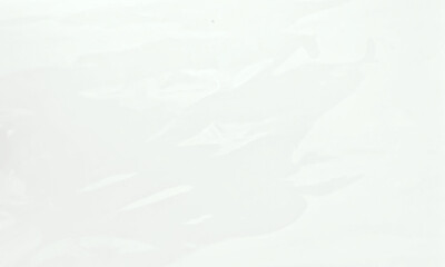 Transparent plastic wrap on transparent background. Stretch film texture. Realistic cellophane sheet. Clear packaging material. Polyethylene wrap mockup. Food or product packaging element
