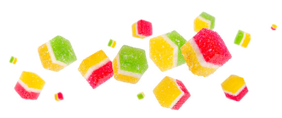 Double colored candied fruit sugar glazed fly and levitate in space. Isolated on white
