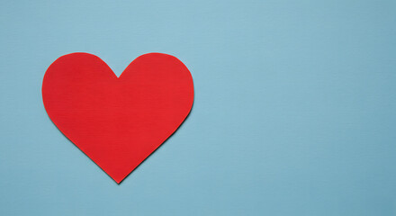 Red Heart Paper Cutout on Blue Background Simple Valentine's Day Design