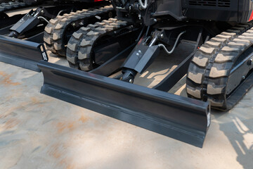 Compact mini excavator new blades and track systems used for digging, leveling ground, and doing...