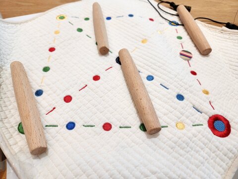 Korean traditional games on the table. There is yutnori with the wooden sticks and fabric mat.