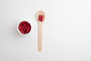 Pills close-up on a color background. Taking vitamins or medications. Concept of healthcare, medicine, pharmacy, disease prevention  