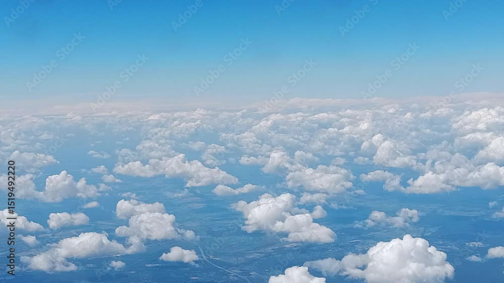 Poster beautiful clouds whizzing by. captured from an airplane window.