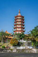 Vertical landscape view of landmark Avalokitesvara or Guanyin pagoda at Vihara Buddhagaya Watugong, Semarang, Central Java, Indonesia