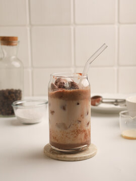 Iced coffee with ice cream float in a glass