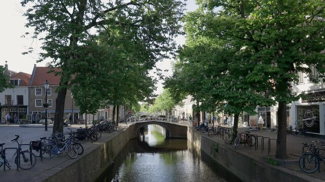 City canal with small bridge in the historic center of Delft, The Netherlands.