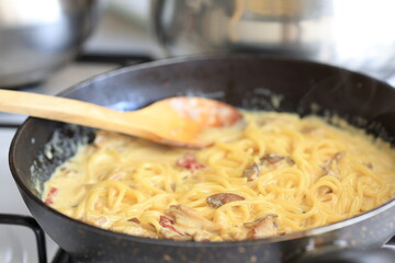 Creamy chicken mushroom spaghetti pasta in close-up