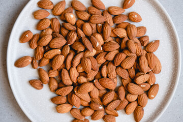 Raw almonds on a plate