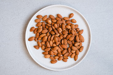 Raw almonds on a plate
