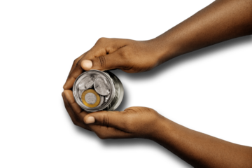 Top flat view of Black Hand holding transparent clear glass bottle jar containing Ghanaian cedis pesewas coins over transparent background. Investment savings and interest concept