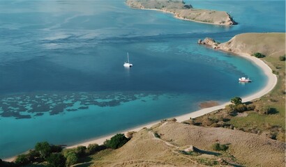 Fototapeta premium Aerial view of Gili Banta's pristine beach and turquoise waters with boats. Perfect for island hopping and snorkeling in Komodo National Park, Indonesia.