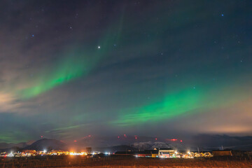 Equinox Aurora and Northern light on the sky, heavenly aurora borealis in green, purple and red...