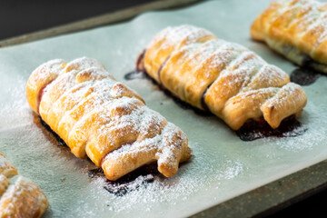 Puff pastry with chocolate and strawberries. Baking. Dessert. Dough.