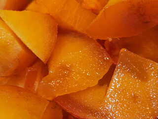 Ripe sweet persimmon. Slices of ripe persimmon