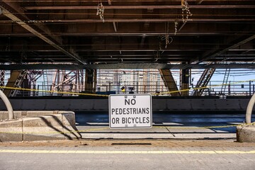 Urban bridge walkway with signs