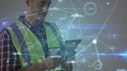 Field technician tapping tablet screen and activating live metrics for construction site monitoring