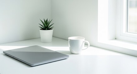 Minimalist Workspace with Laptop and Coffee Mug by the Window