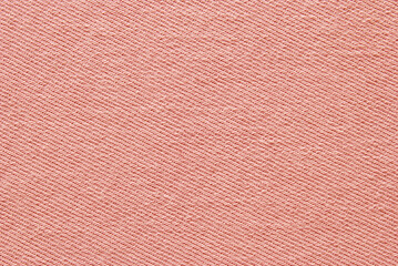 Pink cotton twill fabric pattern close up as background