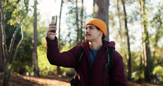 Man, hiking and phone with bad signal in forest for poor reception or network service in nature. Male person, hiker or lost with mobile smartphone for navigation error, app or path finding in woods