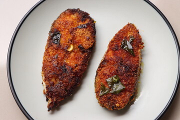 Indian fish fry, Basa or Pangasius, pan fried, marinated with spices
