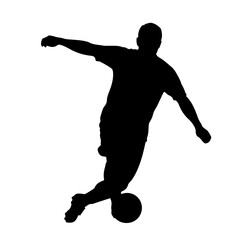 Soccer player silhouette kicking ball