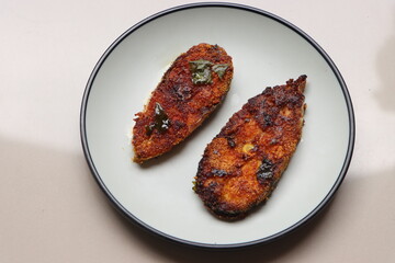 Indian fish fry, Basa or Pangasius, pan fried, marinated with spices